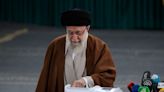 Iranians vote in a parliamentary runoff election after hard-liners dominate initial balloting
