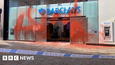 Manchester: Four arrested after Barclays bank covered in paint