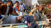 Pakistan mosque attack: At least 100 killed in suicide bombing - as militant commander tries to claim responsibility