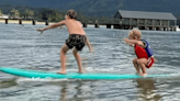 Surfing Power Couple Alana Blanchard and Jack Freestone's Kids Ride First Tandem Wave Together (Clip)