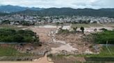 Rains lash southern China as rising rivers threaten more flooding