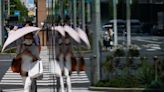 Japan's June flames out with record heat, but power crunch averted