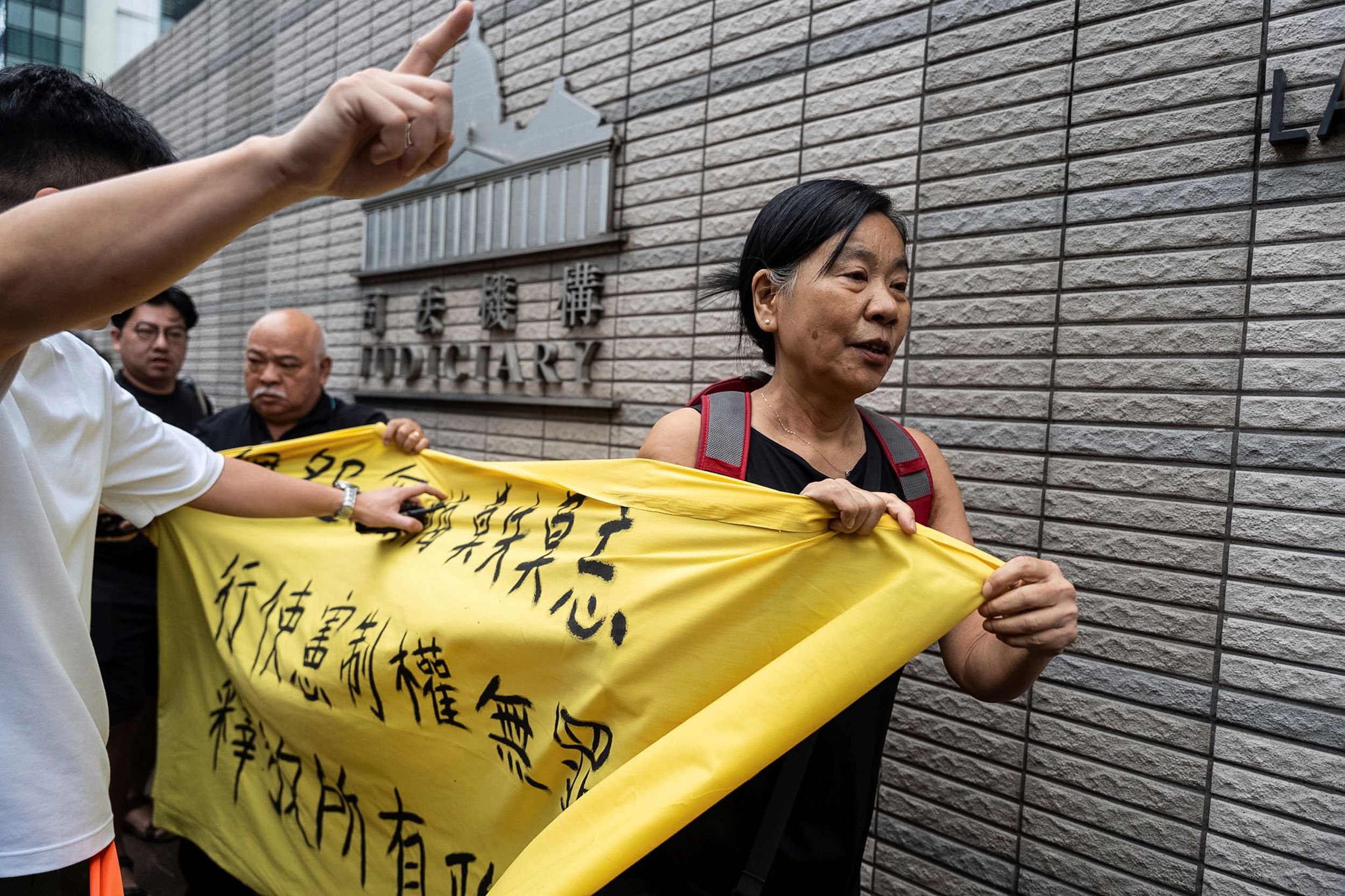 14 Hong Kong democracy campaigners found guilty of subversion