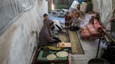 In Gaza, Palestinians return to a shelter scarred by war