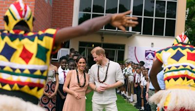 Harry and Meghan visit school as they arrive in Nigeria for three-day visit to promote Invictus Games