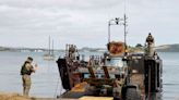 Royal Marines deliver historic cannon to Cornish beach