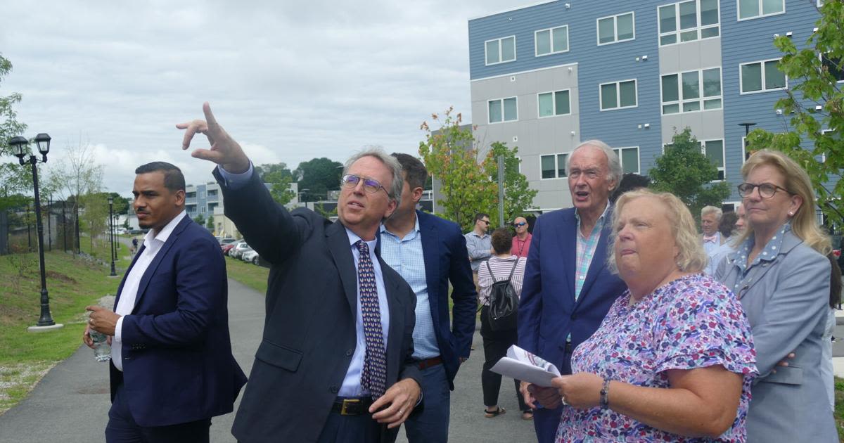 Markey, Moulton tour site of future commuter rail station