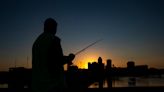 Downtown Des Moines bridge anglers seek the lunkers that lurk in the shadows of skyscrapers