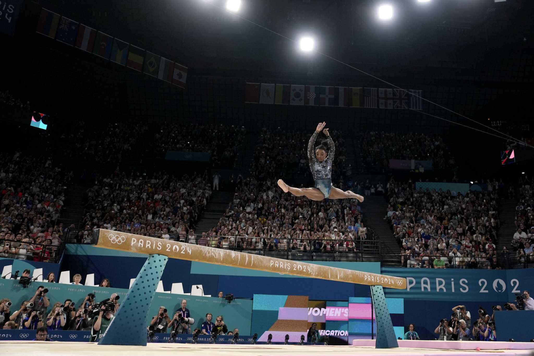 One Extraordinary Photo: Charlie Riedel captures Simone Biles in flight at the Paris Games