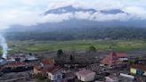 Indonesian rescuers search through rivers and rubble after flash floods