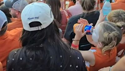 Watch socking moment toddler appears to drink beer at football game