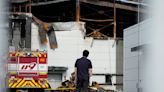 South Korean rescuers search burned factory after a blaze killed 22, mostly Chinese migrants