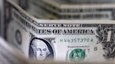 Dollar edges lower, but on track for hefty weekly gains By Investing.com