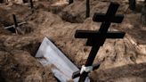 Ukraine news – live: New mass graves found in Izyum after Russian troops flee