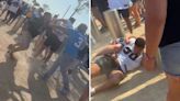 Sickening moment woman is body slammed and man is knocked out in huge NFL brawl