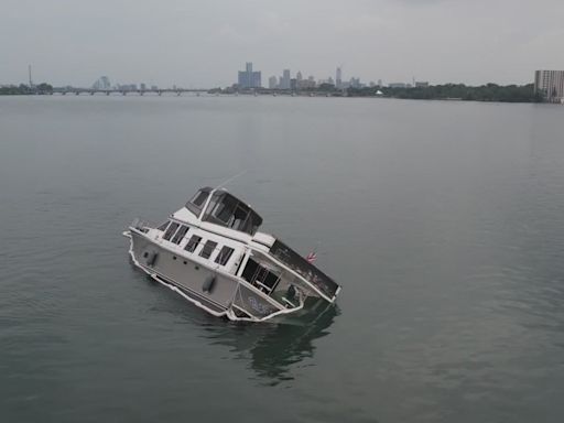 Half-sunken 54-foot boat stuck in Detroit River for days, 20 people rescued
