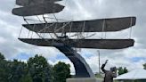 Wright Flyer III sculpture lands at new home in historic district after 2-year departure
