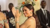 Meghan Nods to the Royals in a Backless Peach Gown Called the “Windsor”