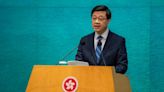 Hong Kong leader hits out after UK charges three with spying for city