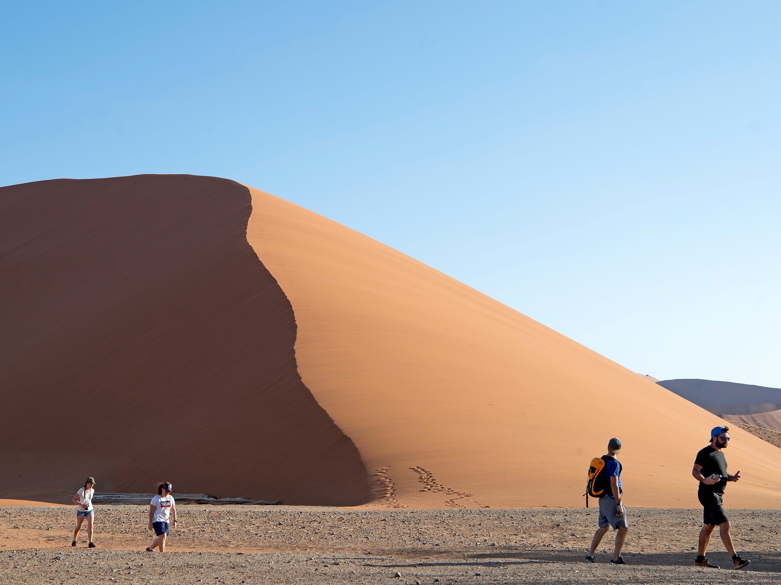 Officials in Namibia criticize tourists who took nude photos atop the Big Daddy dune at national park