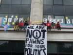 Teenage trans activists scale NHS England London HQ as protest enters third day