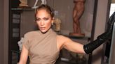 Jennifer Lopez debuts trench coat style at Paris show as Ben Affleck stays in US