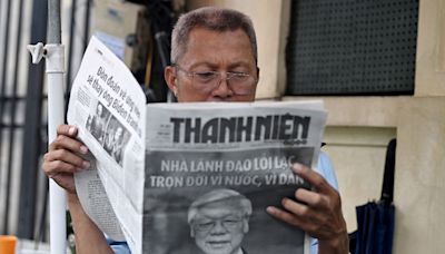 Vietnamese mourn late leader Nguyen Phu Trong with black profile pictures