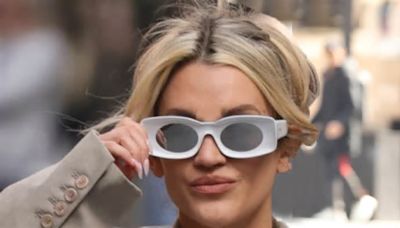 Ashley Roberts debuts futuristic white sunglasses and a striped playsuit as she leaves Heart FM studios with vibrant Amanda Holden