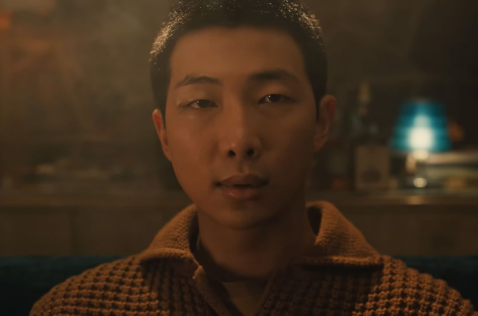 BTS’ RM Plays Multiple Roles (Including a Baby Man) in Cinematic Video For Solo Single ‘Come Back To Me’