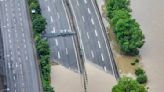 The German chancellor tours flooded regions in the southwest in a show of solidarity