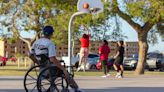 How a basketball coach with cerebral palsy provides a safe space for south Phoenix kids