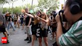 Why Barcelona protesters are squirting water at tourists - Times of India