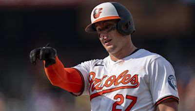 Orioles catcher McCann shrugs off fastball to face, stays in game against Jays
