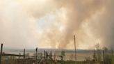 Looming fires force thousands of Canadians to evacuate. Some may not return home until next week