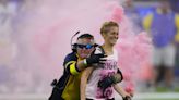 Protesters interrupt NFL's season-opener between Bills-Rams with pink smoke bombs