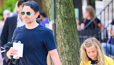 Bradley Cooper the doting dad holds hands with daughter Lea De Seine, seven - after 'celebrating Gigi Hadid's birthday with her in Las Vegas'