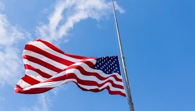 Why are flags at half-staff on Friday in Virginia?