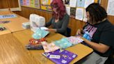 Antioch students sewing quilts, making care bags for kids facing challenges