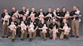 Sheriff's office celebrates major 'baby boom' as law enforcement poses for sweet photo with their 15 kids