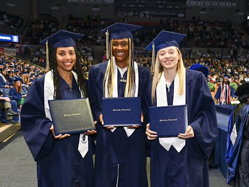 Paige Bueckers, Aaliyah Edwards dance at Gampel Pavilion as the UConn stars take part in graduation