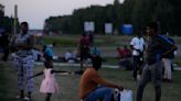 Buses move 400 asylum-seekers from squalid Dutch camp