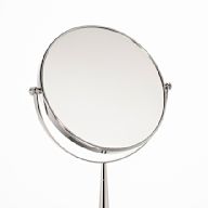 Typically smaller mirrors placed on a makeup table or vanity. Often equipped with lighting for optimal visibility during grooming.