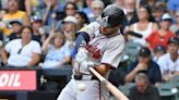 Braves use clutch hits, power display to down Brewers