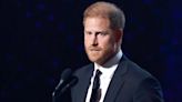 Harry collects award honouring war hero despite calls to hand it back