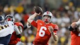 Ohio State coach Ryan Day hopes a starter emerges from QB pair, but he isn't ruling out playing both