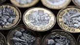 Pound dips as interest rates rise and Bank of England says inflation passed its peak