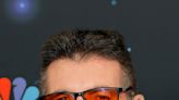 Why does Simon Cowell wear red-tinted glasses?