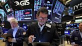 Wall St stocks end lower, dollar gains after data; Fed, earnings in the wings