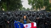 Protesters throng streets of Georgia’s capital after parliament passes so-called ‘Russian law’