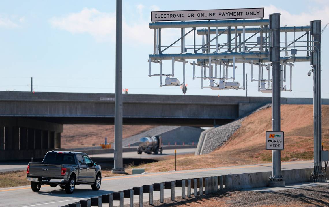 How do Kansas businesses get logos on those blue signs on the highways and turnpike?